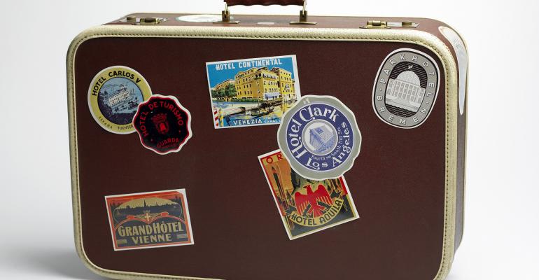 Suitcase with travel stickers