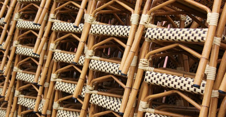 stacks of rattan chairs