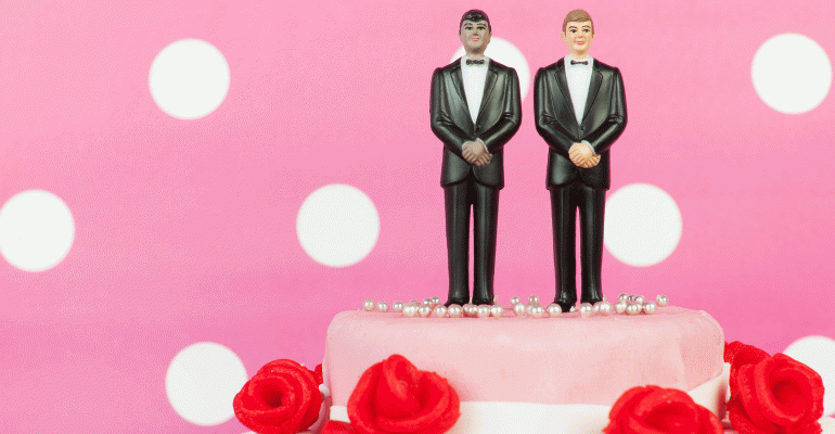 Two grooms on wedding cake
