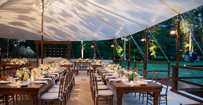 A beautiful wedding from Stamford Tent and Event Services featuring farm tables