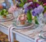 Colorful floral sings against a rustic table thanks to TicTock Couture Florals Photo by Armen Asadorian Photography
