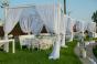 Draped dining area for seaside wedding